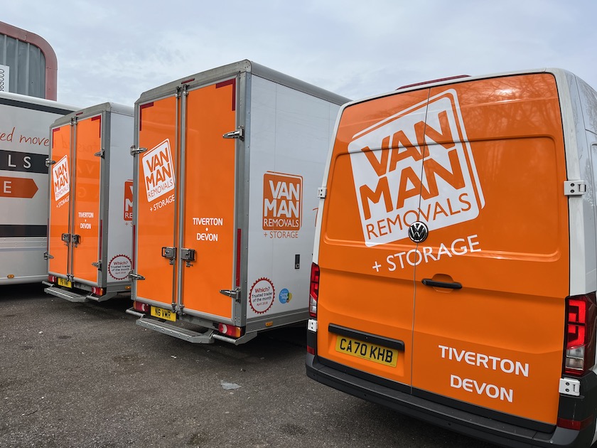 a row of van with orange backs