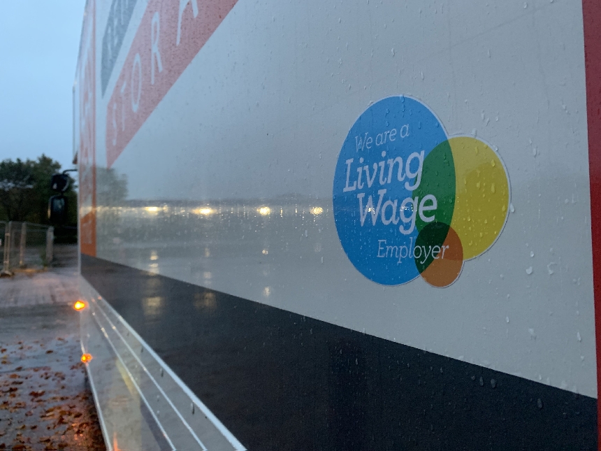 a living wage employer sticker on a removals lorry 