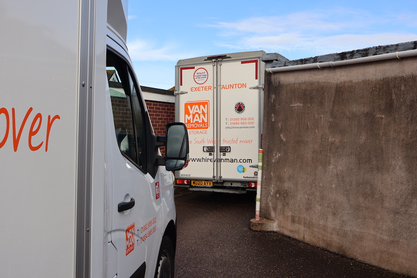 Removal vans loading in narrow streets of Topsham Devon